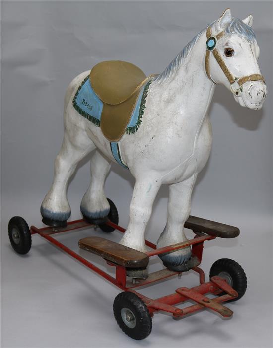 A pull along wooden toy horse